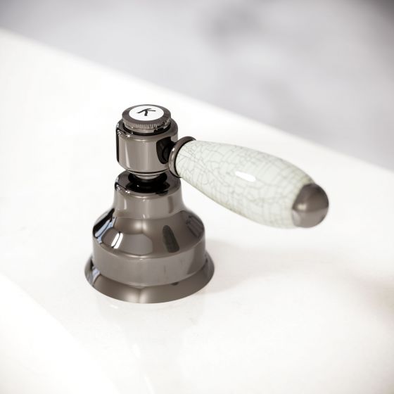 Jörger Delphi washbasin fittings in mink with  lever handles of white porcelain, covered in a fine network of craquelure