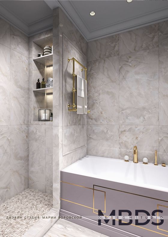 Jörger Design Belledor bath mixer and shower mixer in precious brass in an Art Deco style bathroom setting.