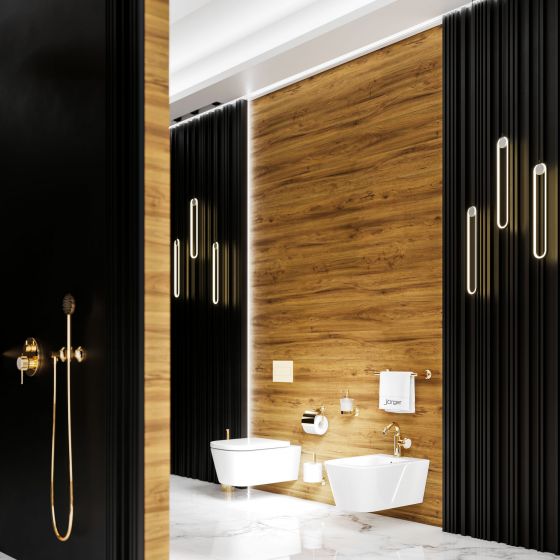 Jörgers Valencia fittings and accessories in the exclusive finish sunshine. The room view shows the WC area with bidet with white and black wall elements. Also wooden walls. They create a very comfortable ambience.
